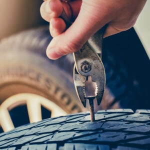Hand Pulling For Removing A Nail In The Tire,flat Tire Fixing And Repair The Tire Is Leaking From The Tack